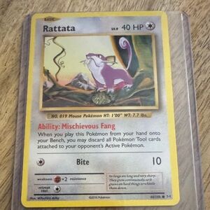 Rattata Pokémon Card with Purple and Yellow Design
